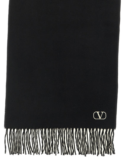 Scarf by Valentino Garavani for men in cashmere bicolour, black, white & signature showcases a warm silhouette from the Icon V Logo Cashmere Shawl Stole Fringes Scarf collection, offering a warm drape that exudes sophisticated luxury.