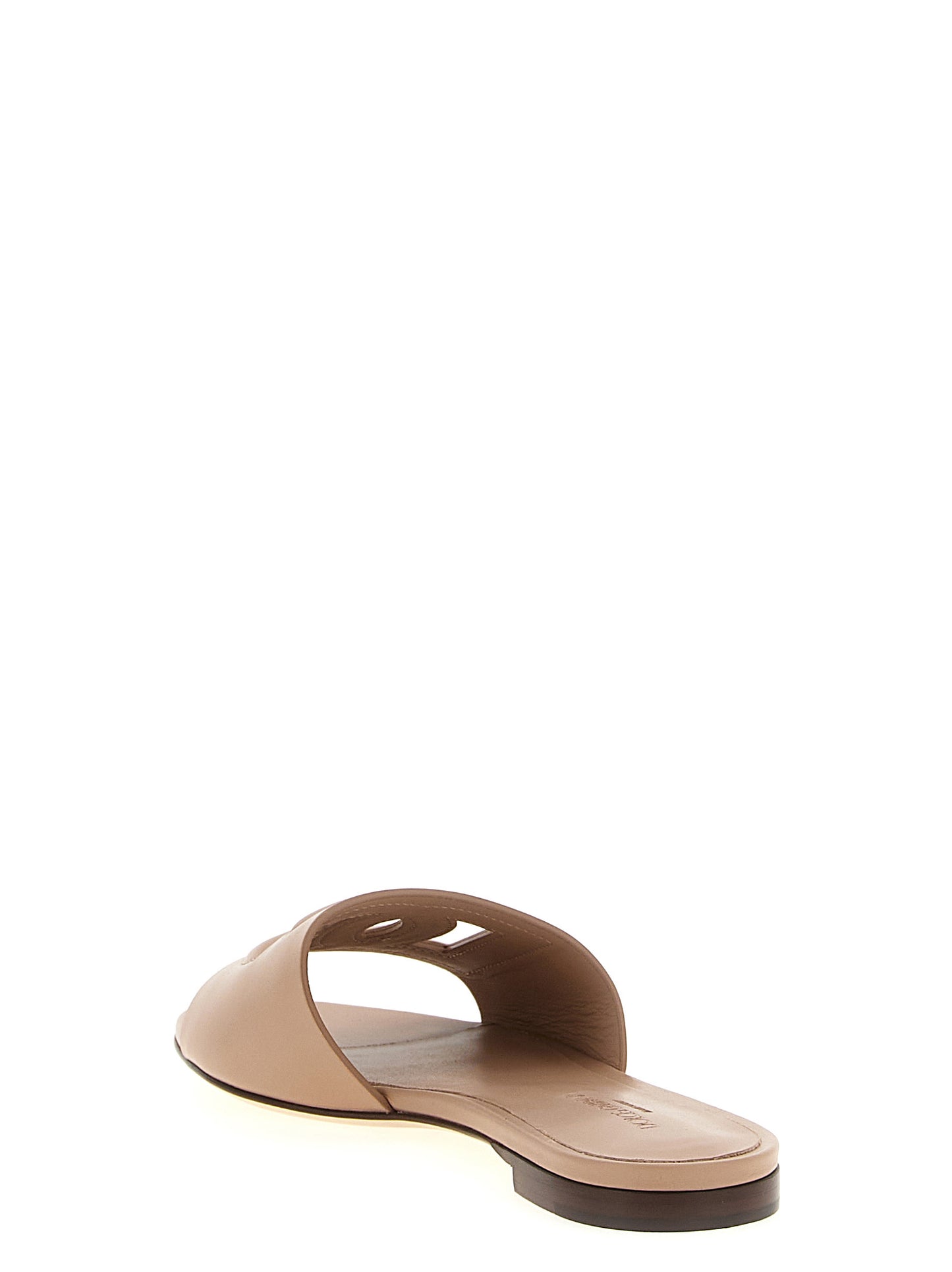 Sliders Flat Shoes by Dolce & Gabbana for women in calfskin leather beige presents a effortless chic silhouette, showcasing the Women's Calfskin Leather Sliders Flat Shoes design with a effortless chic and for a sophisticated look.
