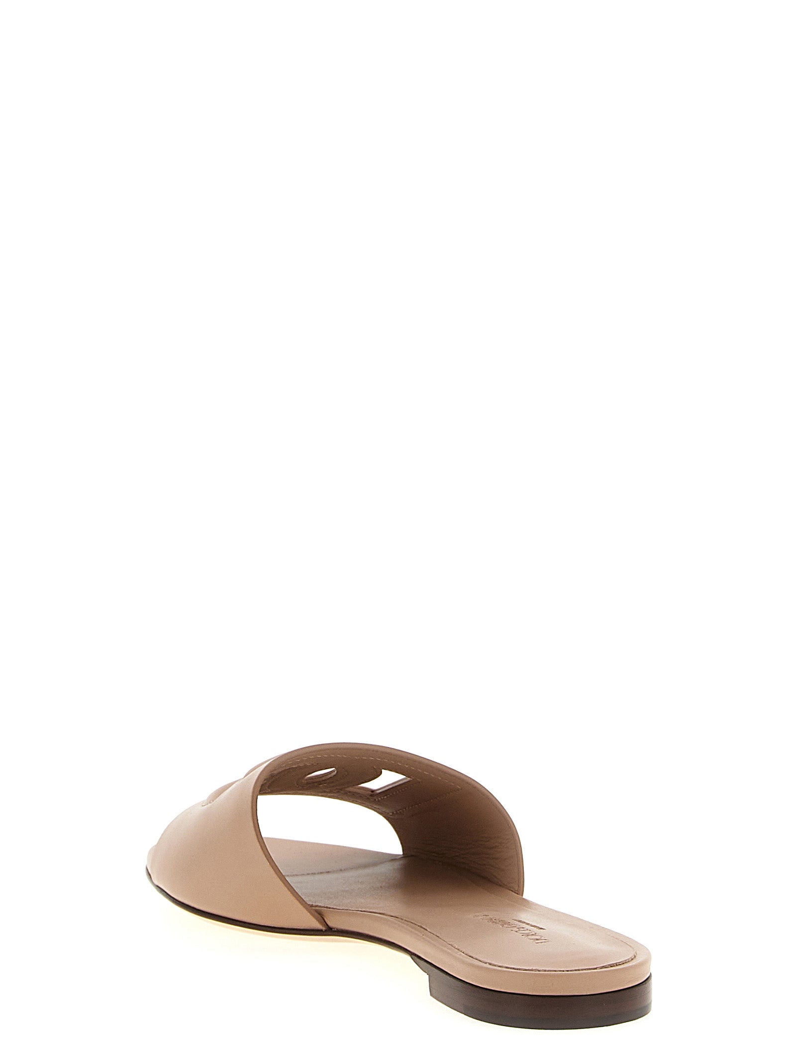 Sliders Flat Shoes by Dolce & Gabbana for women in calfskin leather beige presents a effortless chic silhouette, showcasing the Women's Calfskin Leather Sliders Flat Shoes design with a effortless chic and for a sophisticated look.