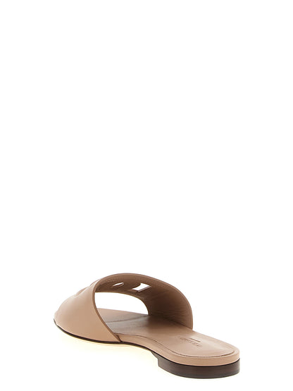 Sliders Flat Shoes by Dolce & Gabbana for women in calfskin leather beige presents a effortless chic silhouette, showcasing the Women's Calfskin Leather Sliders Flat Shoes design with a effortless chic and for a sophisticated look.