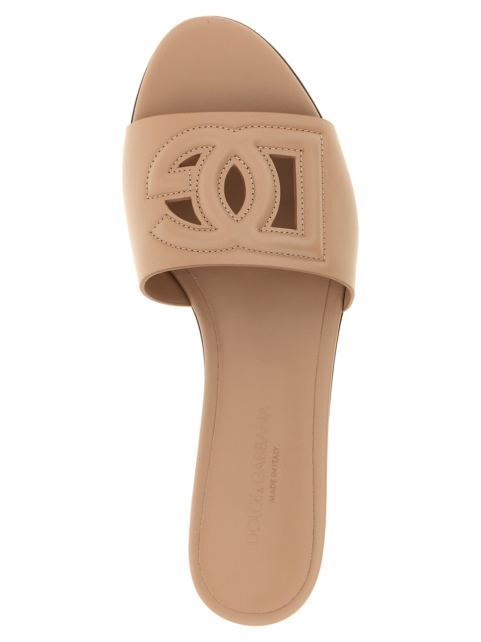 Sliders Flat Shoes by Dolce & Gabbana for women in calfskin leather beige features an captivating silhouette, showcasing the captivating style of the Women's Calfskin Leather Sliders Flat Shoes with its distinct and refined .