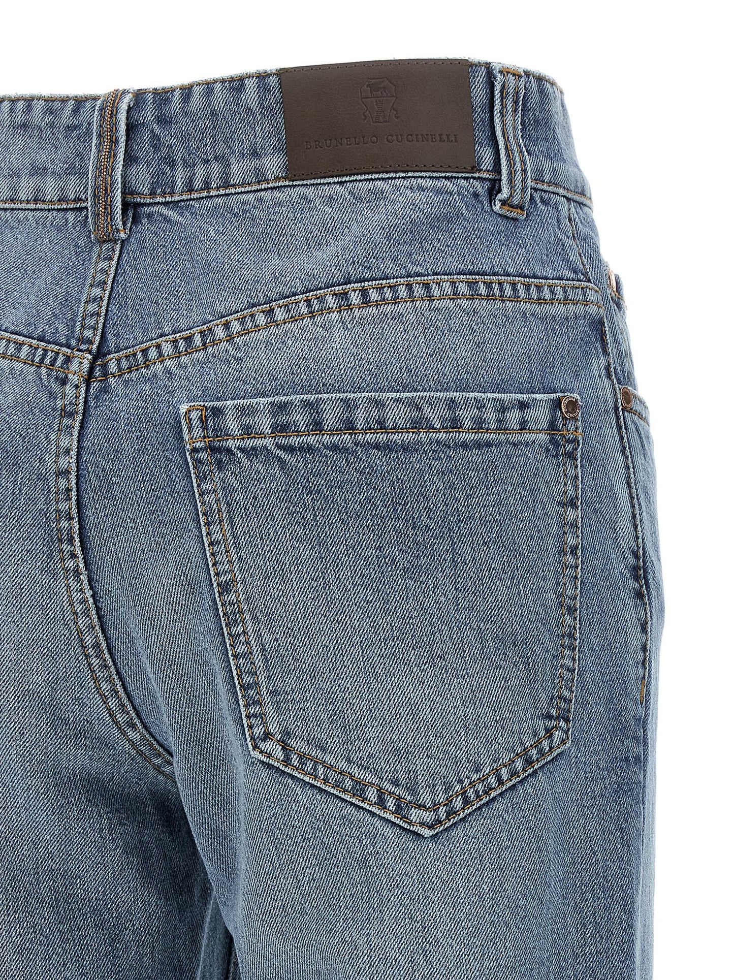 Jeans by Brunello Cucinelli for women in stretch cotton denim & leather blue, brown & copper features a refined silhouette with a refined straight-leg, relaxed-fit & cropped, defined by a and a refined cropped for a refined finish.