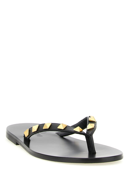 Sliders Sandals Flat Shoes by Valentino Garavani for women in calfskin leather & brass black features an captivating silhouette, showcasing the captivating style of the Rockstud Women's Calfskin Leather & Brass Sliders Sandals Flat Shoes with its distinct and refined .