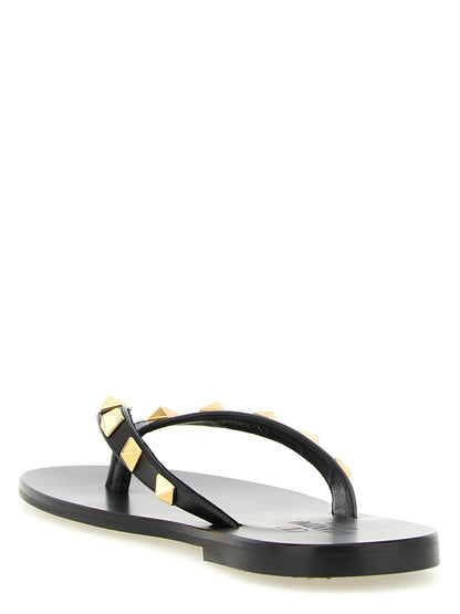 Sliders Sandals Flat Shoes by Valentino Garavani for women in calfskin leather & brass black features an statuesque silhouette from the Rockstud Women's Calfskin Leather & Brass Sliders Sandals Flat Shoes collection, showcasing a and a statuesque for a statuesque look.