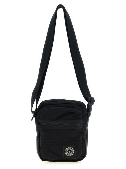 Compact Crossbody Messenger Bag by Stone Island for men in nylon black features a distinguished Nylon Compact Crossbody Messenger Bag design with a secure snap, zipper & button, ample , and versatile crossbody-strap & adjustable-strap for a distinguished look.