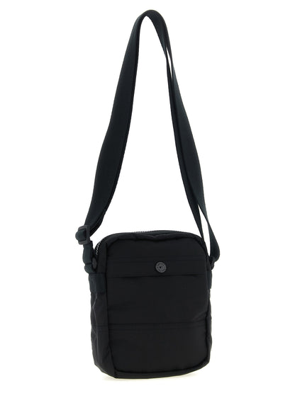 Compact Crossbody Messenger Bag by Stone Island for men in nylon black features a statement-making Nylon Compact Crossbody Messenger Bag design with a secure snap, zipper & button, statement-making , and versatile crossbody-strap & adjustable-strap for a sophisticated look.