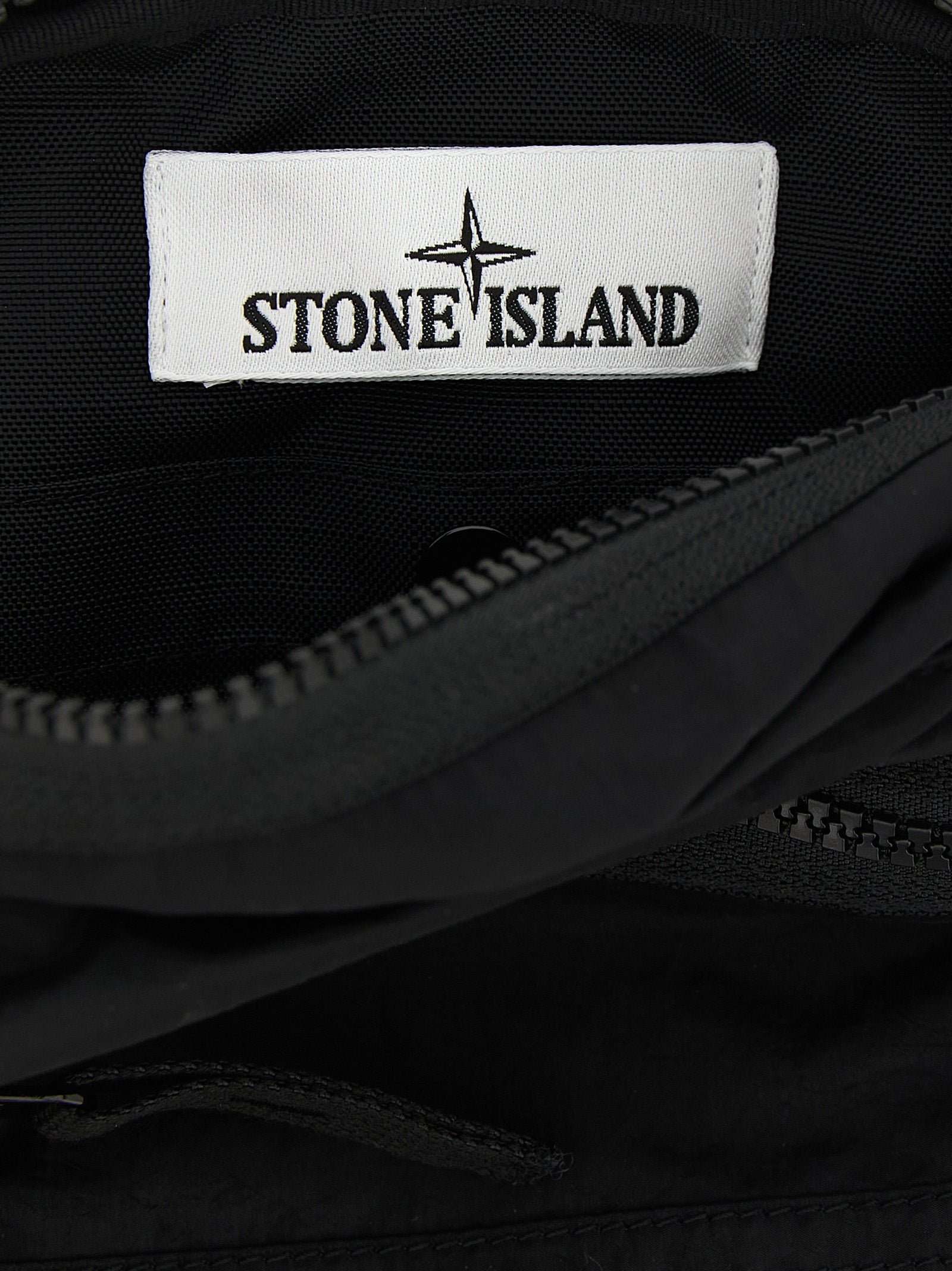 Compact Crossbody Messenger Bag by Stone Island for men in nylon black showcases a stylish Nylon Compact Crossbody Messenger Bag design, featuring a secure snap, zipper & button and ample with versatile crossbody-strap & adjustable-strap for a stylish look.