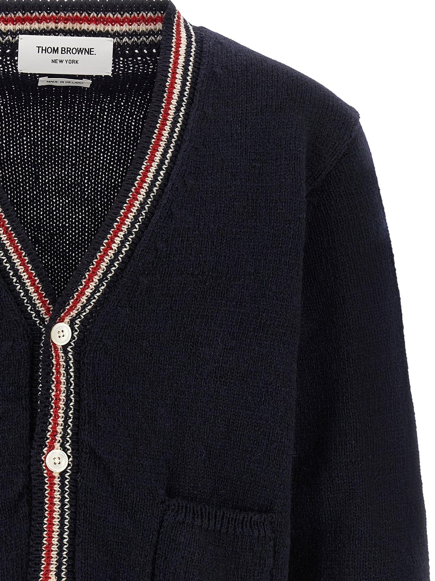 Cardigan by Thom Browne for men in mohair wool navy & striped features a nuanced silhouette with a refined v-neck neckline and nuanced detailing for a sophisticated look.