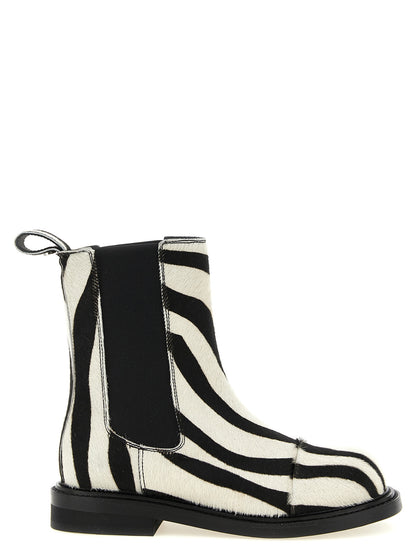 Flat Ankle Chelsea Boots by Moschino for women in calfskin leather bicolour, black, white, zebra & patterned features an high-performance silhouette, showcasing the sophisticated design of the Women's Calfskin Leather Flat Ankle Chelsea Boots with a flat and a refined .