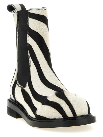 Flat Ankle Chelsea Boots by Moschino for women in calfskin leather bicolour, black, white, zebra & patterned features an effortless chic silhouette from the Women's Calfskin Leather Flat Ankle Chelsea Boots collection, showcasing a effortless chic flat and refined for an effortless chic look.