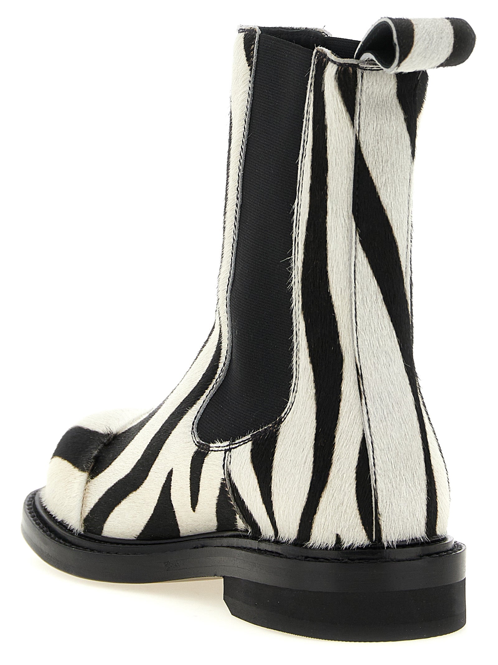 Flat Ankle Chelsea Boots by Moschino for women in calfskin leather bicolour, black, white, zebra & patterned features an avant-garde Women's Calfskin Leather Flat Ankle Chelsea Boots silhouette, defined by a sophisticated flat and a avant-garde .