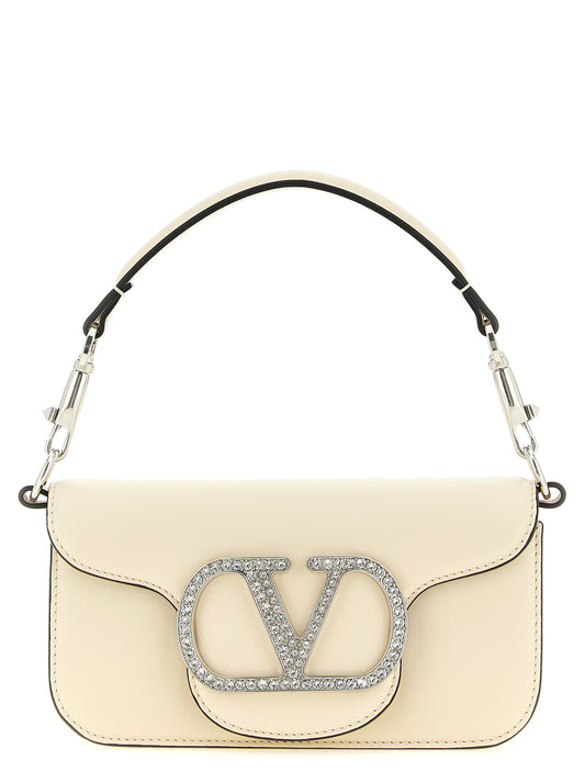 Small 2-in-1 Shoulder & Crossbody Flap Bag by Valentino Garavani for women in bos taurus suede calf leather white & signature features a effortless sophistication silhouette, secured by a flap & magnetic with ample and versatile crossbody-strap, shoulder-strap, detachable-strap & handle for a effortless sophistication finish.
