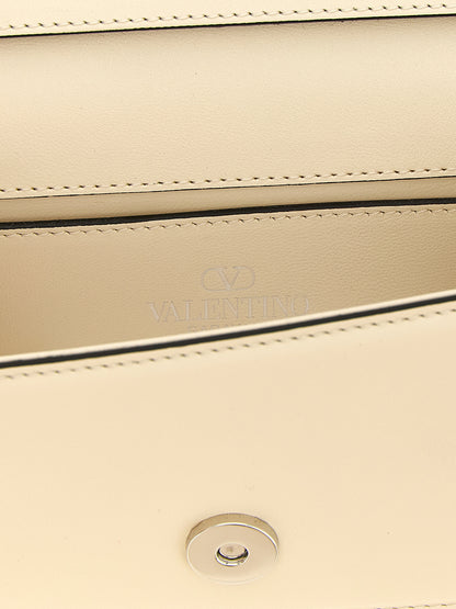 Small 2-in-1 Shoulder & Crossbody Flap Bag by Valentino Garavani for women in bos taurus suede calf leather white & signature showcases a enviable silhouette, artfully detailed with a secure flap & magnetic, organized , and versatile crossbody-strap, shoulder-strap, detachable-strap & handle for a enviable look.