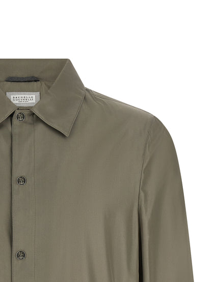 Overcoat by Brunello Cucinelli for men in polyurethane & silk bicolour & green presents a luxurious silhouette, showcasing a luxurious and sophisticated pockets for a premium, luxurious look.