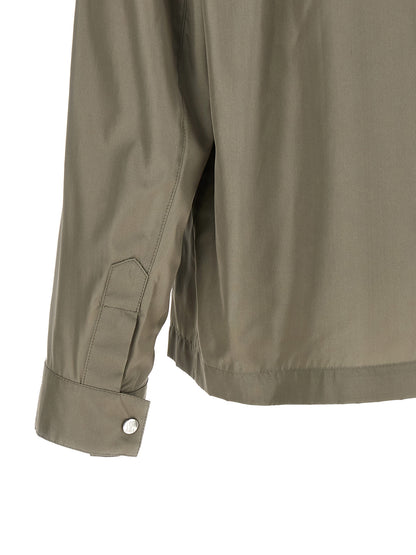 Overcoat by Brunello Cucinelli for men in polyurethane & silk bicolour & green features an satoral silhouette, showcasing a sophisticated and satoral pockets for a premium, timeless look.