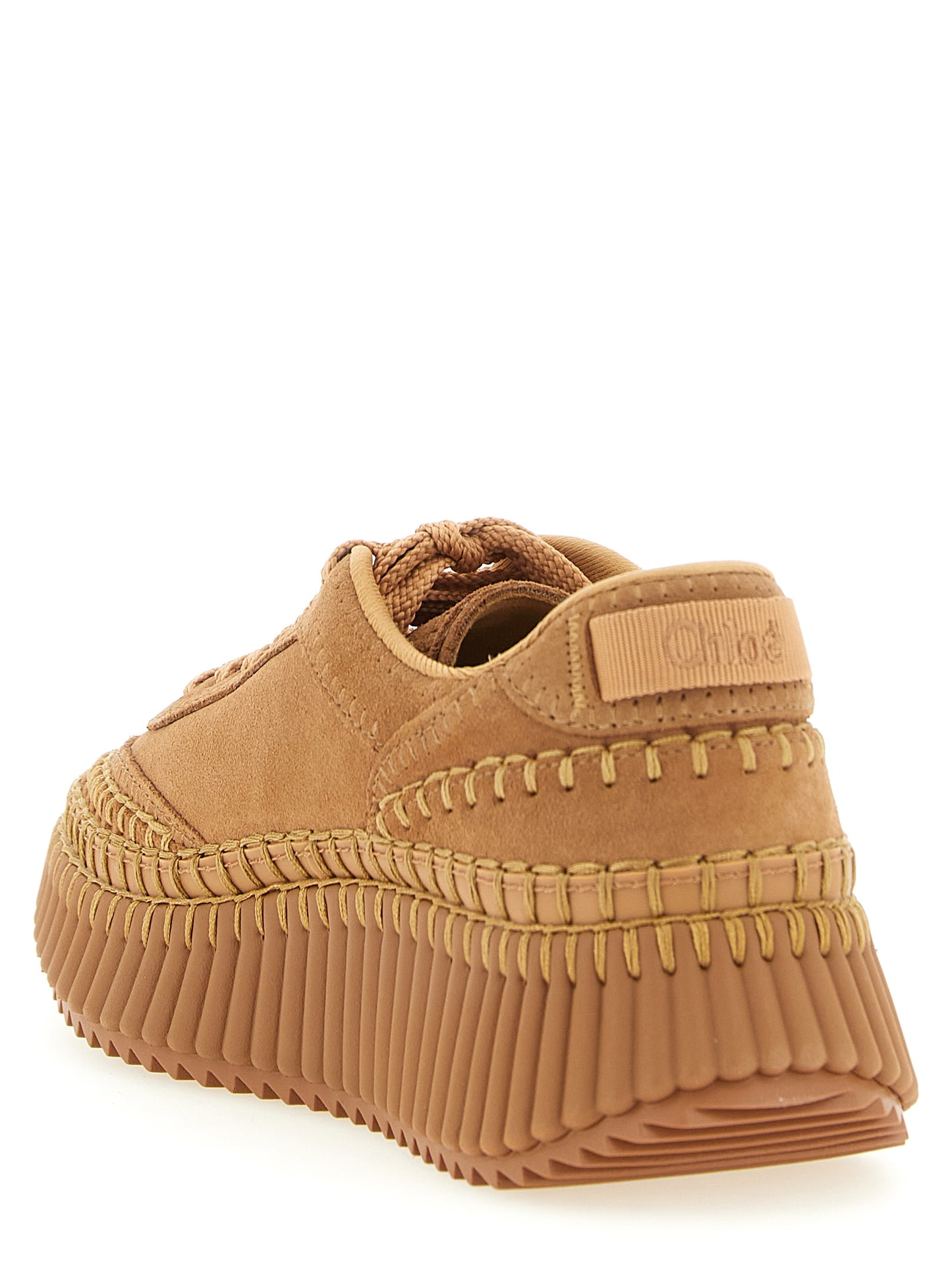 Sneakers by Chloé for women in polyester suede leather beige & camel presents a sumptuous silhouette, artfully capturing the essence of the Women's Fashion Polyester Suede Leather Sneakers with its sumptuous fashion style design.