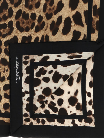 Scarf by Dolce & Gabbana for women in silk black, brown, white, leopard-print, signature & print features a timeless silhouette, artfully capturing the essence of the timeless Silk Scarf design for a sophisticated look.