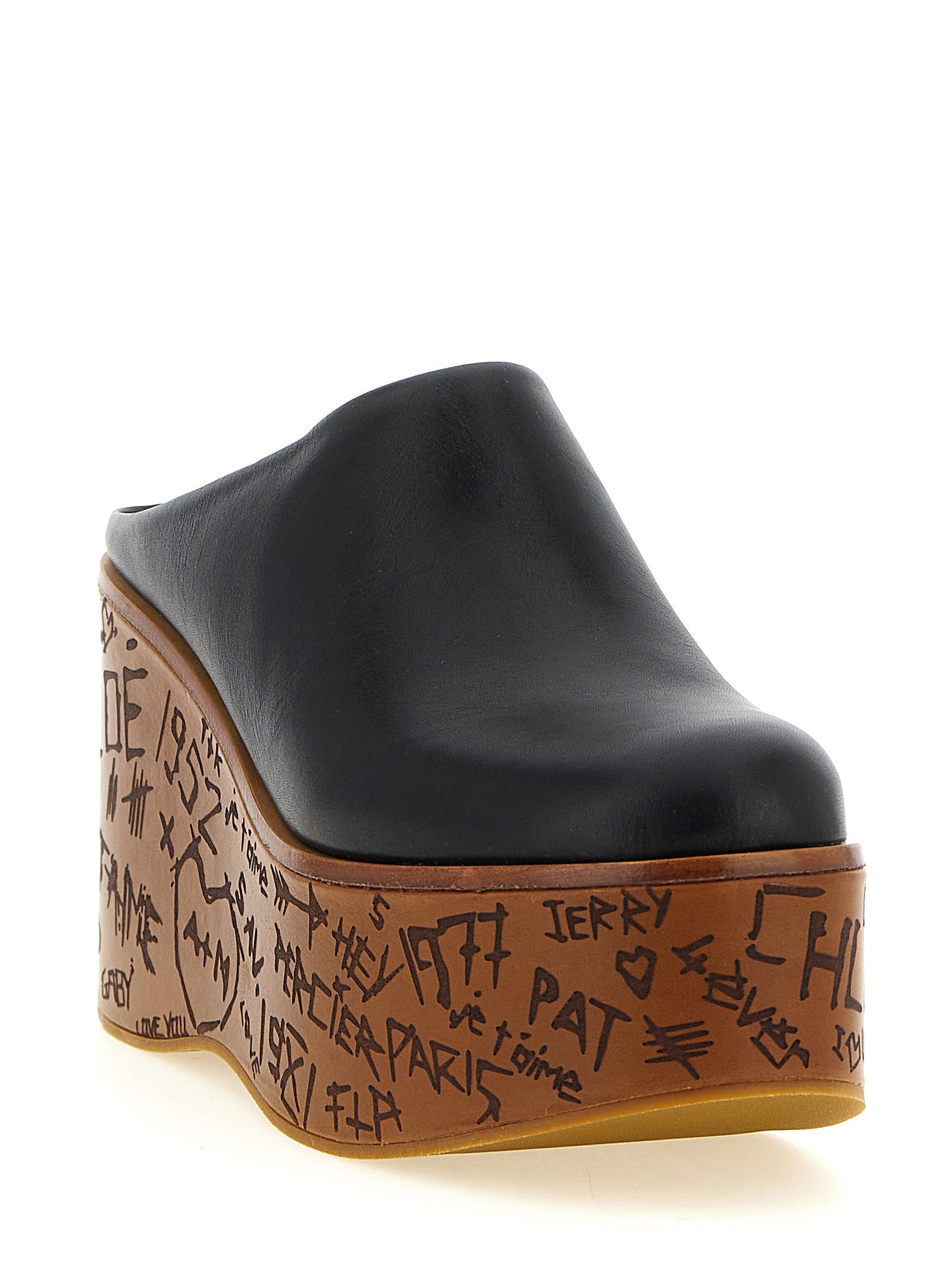 Wedge Sandals by Chloé for women in wood & calfskin leather black features an effortlessly chic silhouette from the Aren Women's Wood & Calfskin Leather Wedge Sandals collection, showcasing a effortlessly chic wedge and elegant .