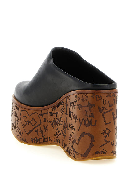 Wedge Sandals by Chloé for women in wood & calfskin leather and black presents a captivating silhouette, showcasing the signature style of the Aren Women's Wood & Calfskin Leather Wedge Sandals with a captivating wedge and captivating .