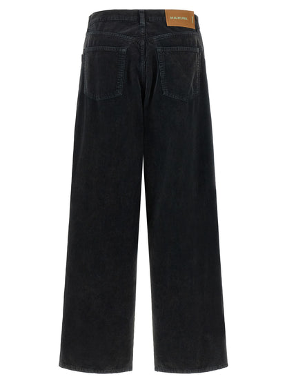 Jeans by Haikure for women in denim cotton black & camel features an sartorial flared & wide and long with a cut for a sartorial finish.