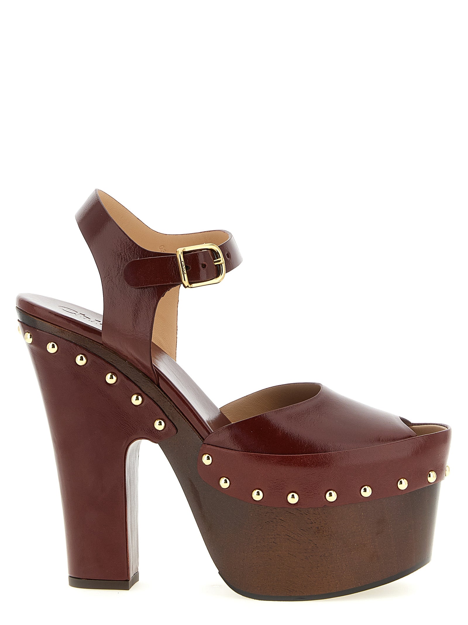 Platform Stiletto Ankle Strap Clogs Sandals by Chloé for women in embossed lamb leather burgundy & gold presents a sculptural silhouette, showcasing the Women's Embossed Lamb Leather Platform Stiletto Ankle Strap Clogs Sandals design with a sculptural stiletto platform and for a premium look.