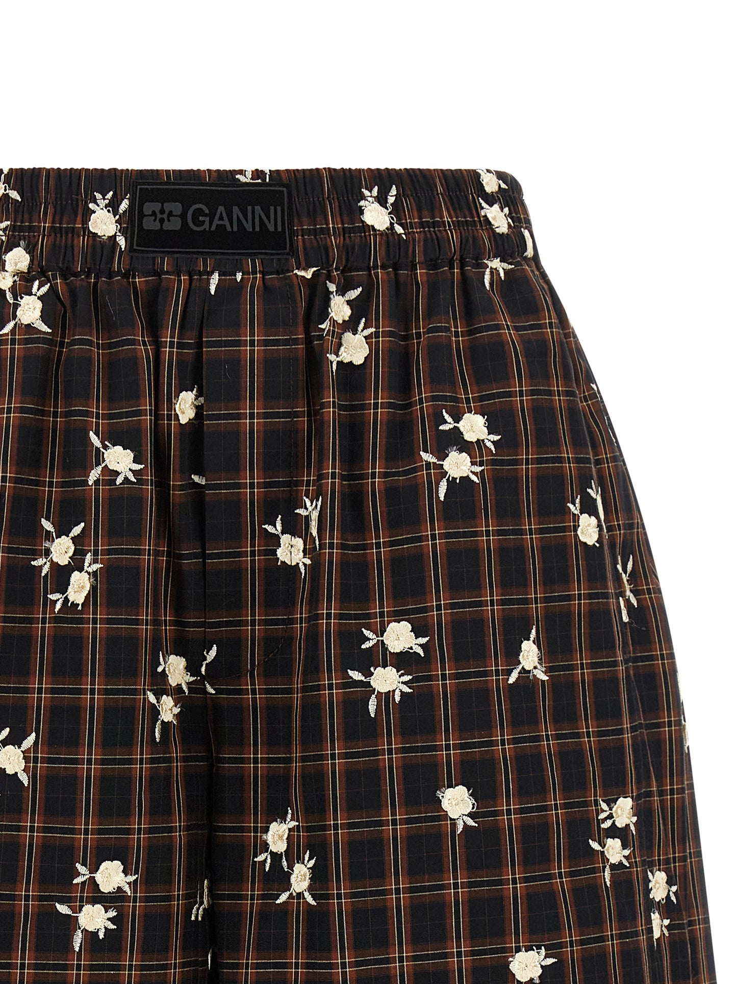 Bermuda Shorts by Ganni for women in organic cotton black, brown, white, patterned & floral presents a sleek silhouette, featuring a sleek wide with a refined short and a sophisticated .