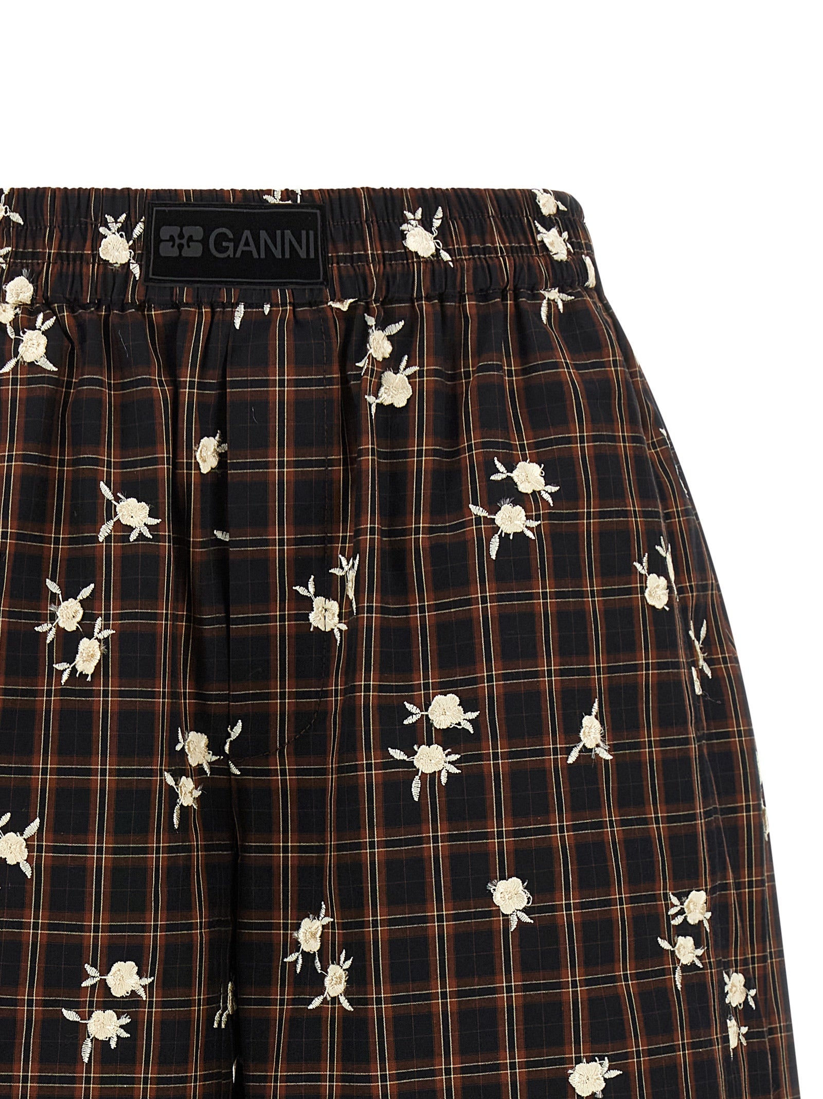 Bermuda Shorts by Ganni for women in organic cotton black, brown, white, patterned & floral presents a sleek silhouette, featuring a sleek wide with a refined short and a sophisticated .
