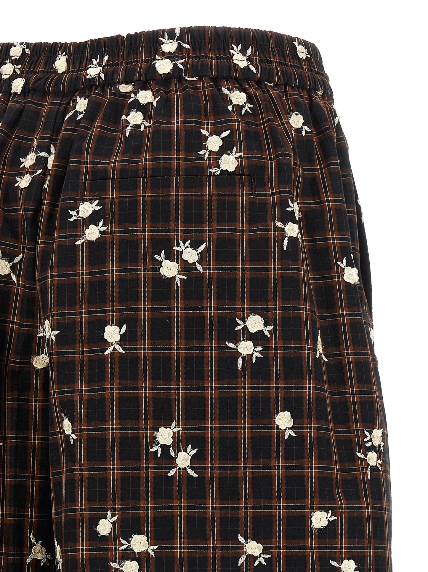 Bermuda Shorts by Ganni for women in organic cotton black, brown, white, patterned & floral presents a contemporary silhouette, showcasing a contemporary wide with a refined short and elegant .