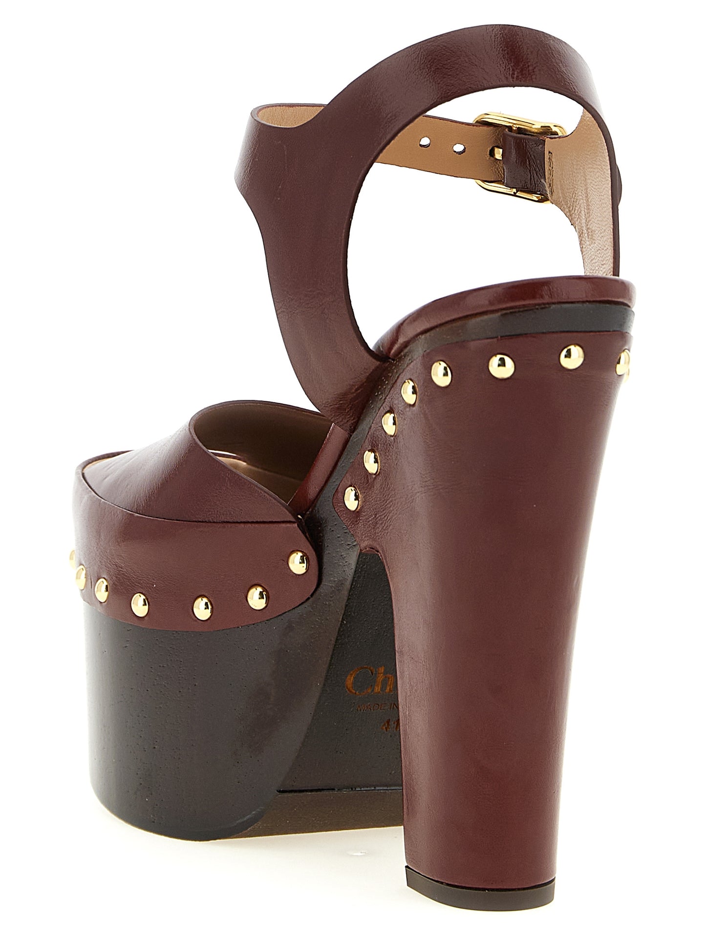Platform Stiletto Ankle Strap Clogs Sandals by Chloé for women in embossed lamb leather burgundy & gold features an exquisite silhouette, showcasing the exquisite Women's Embossed Lamb Leather Platform Stiletto Ankle Strap Clogs Sandals with a stiletto platform and .