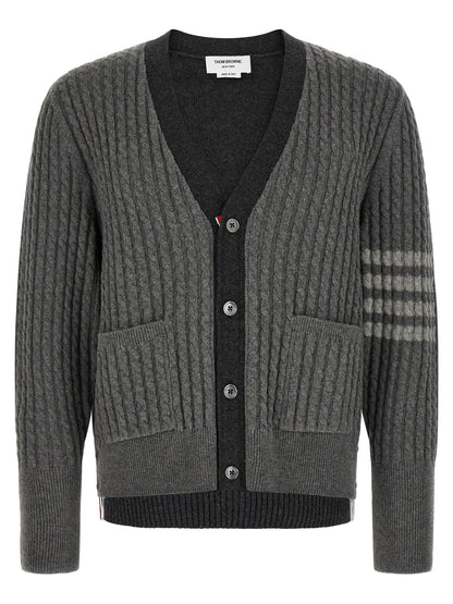 Cardigan by Thom Browne for men in virgin wool gray & signature features a nuanced silhouette with a refined v-neck neckline and nuanced detailing for a sophisticated look.