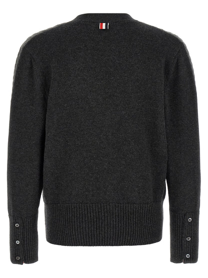 Cardigan by Thom Browne for men in virgin wool gray & signature features an impeccable silhouette, showcasing a sophisticated v-neck neckline and detail for a truly impeccable finish.