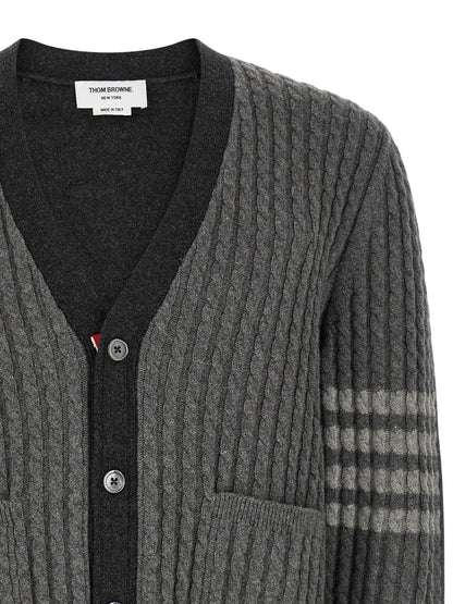Cardigan by Thom Browne for men in virgin wool gray & signature features a dramatic silhouette, showcasing a sophisticated v-neck neckline and dramatic detail for a timeless, premium look.