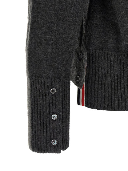 Cardigan by Thom Browne for men in virgin wool gray & signature features an crisp silhouette, showcasing a sophisticated and detail for a truly crisp finish.