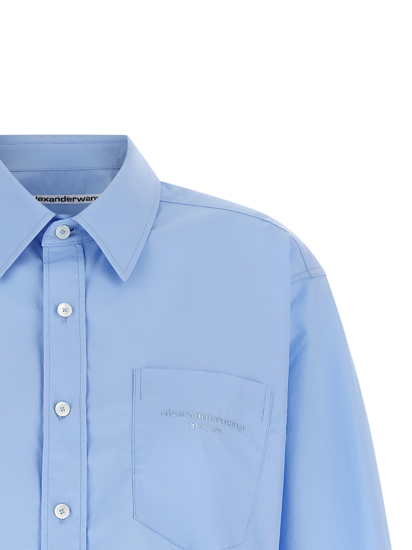Blouse by Alexander Wang for women in cotton light-blue presents a discerning silhouette, showcasing a sophisticated and for a truly discerning finish.