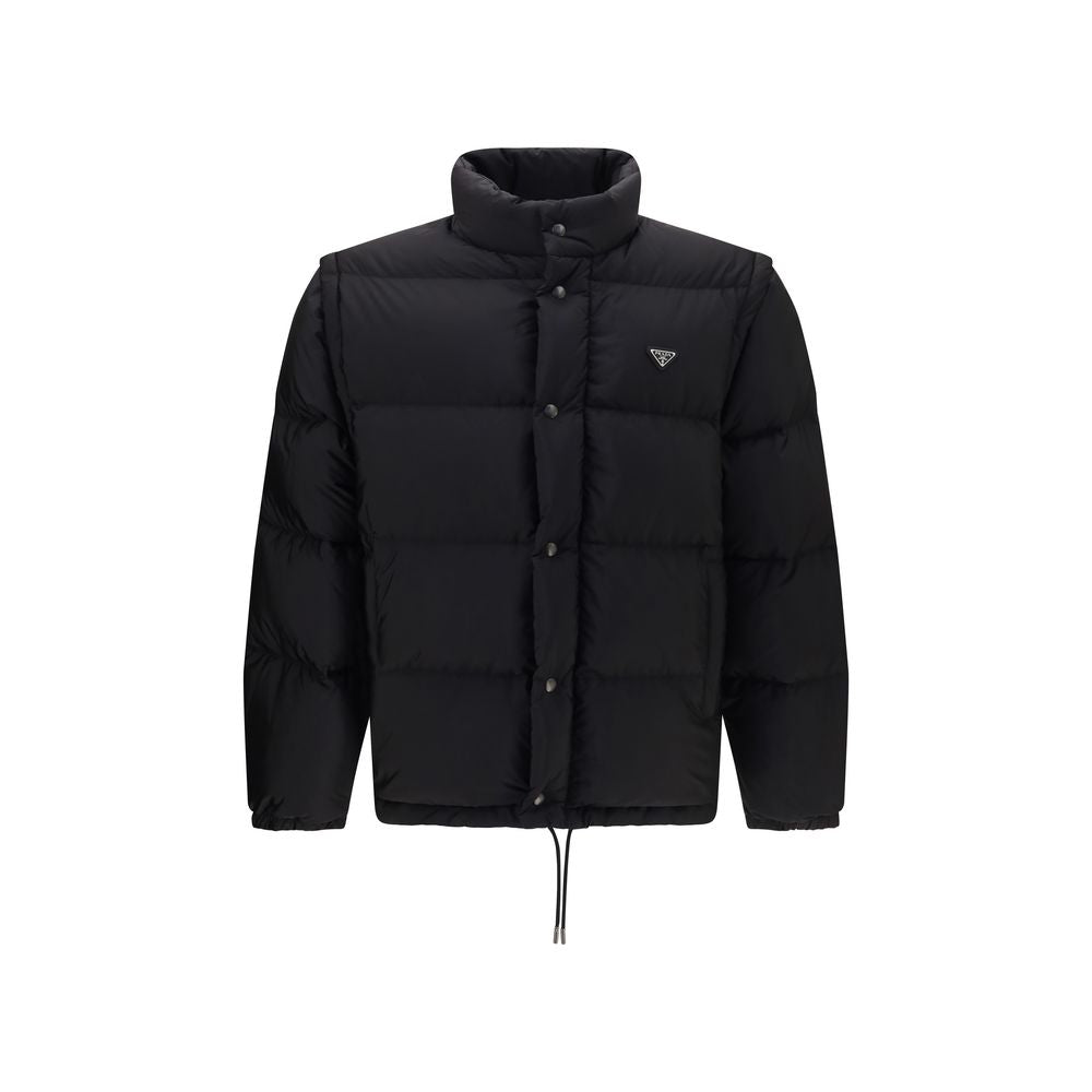 Puffer Jacket by Prada for men in nylon & goose down black features a dramatic silhouette, showcasing a sophisticated high-neck neckline and distinctive pockets & insulated for a dramatic aesthetic.