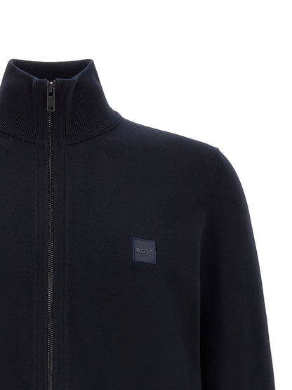 Cardigan by Hugo Boss for men in cotton & cashmere blue presents a textural silhouette, artfully finished with a textural square high-neck neckline and for a sophisticated, textural look.
