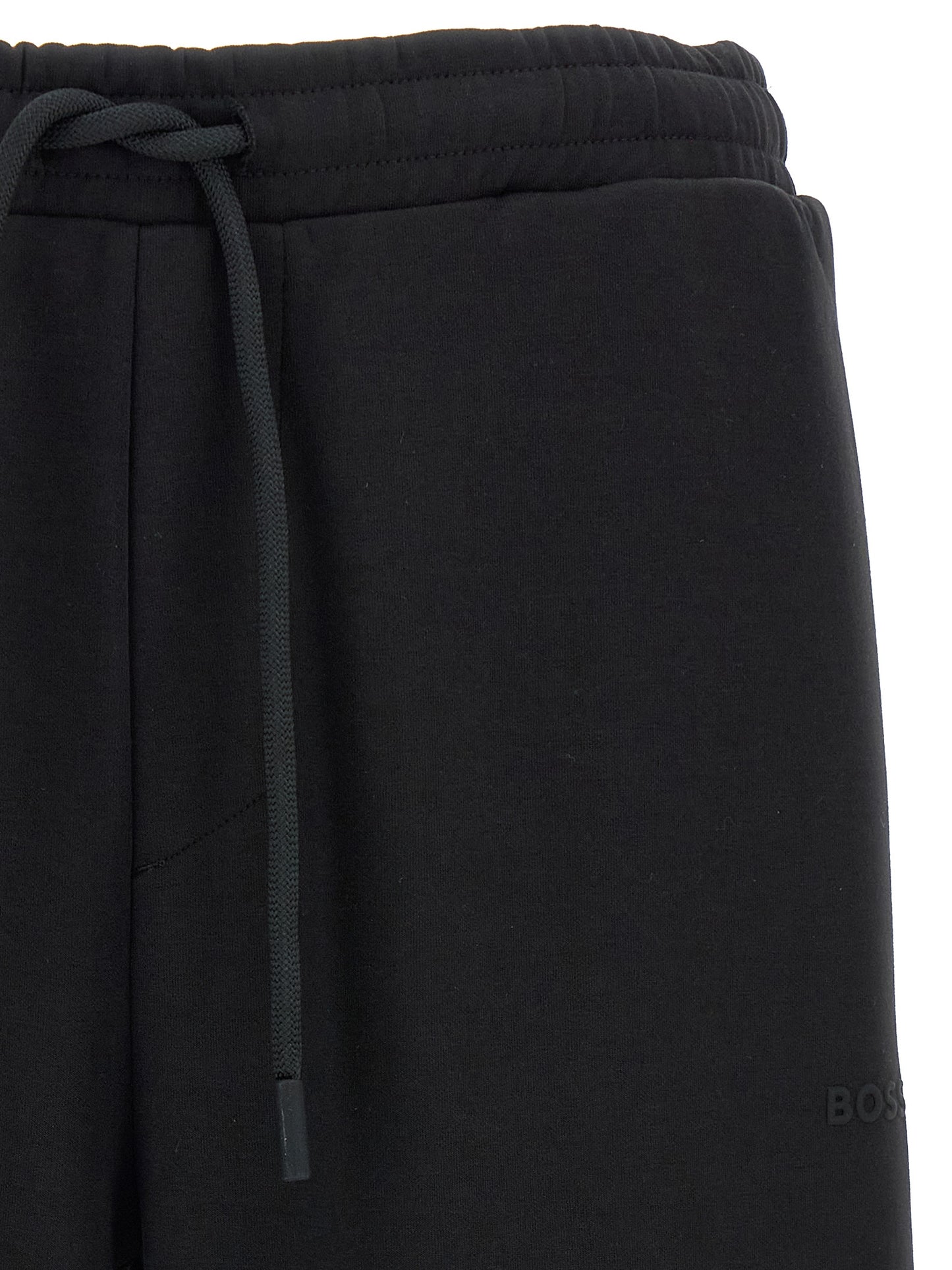 Joggers by Hugo Boss for men in stretch cotton black presents a refined pantology silhouette, artfully defined by a refined pantology , long, and a sophisticated .