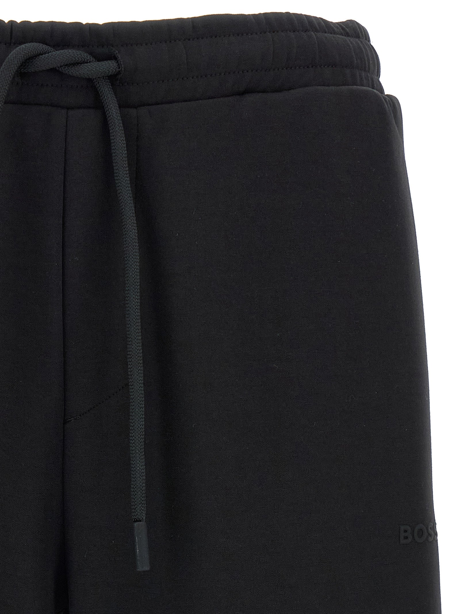 Joggers by Hugo Boss for men in stretch cotton black presents a refined pantology silhouette, artfully defined by a refined pantology , long, and a sophisticated .