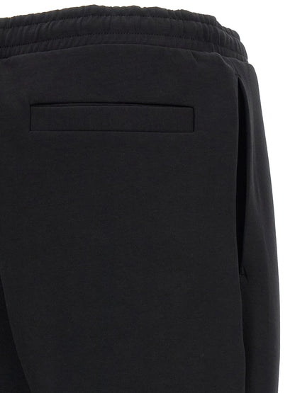 Joggers by Hugo Boss for men in stretch cotton black features an refined tailoring silhouette, showcasing a premium with a and long cut for a refined tailoring look.