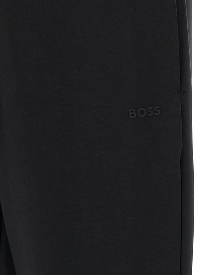 Joggers by Hugo Boss for men in stretch cotton black features an sartorial and long with a cut for a sartorial finish.