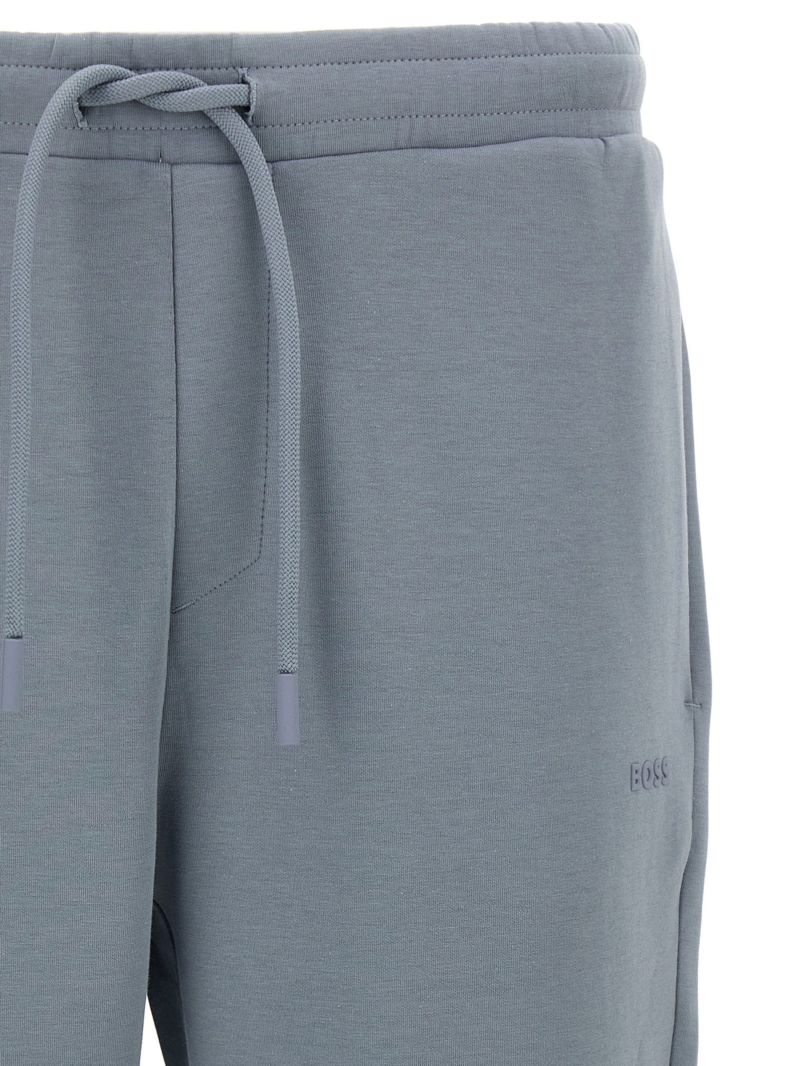 Joggers by Hugo Boss for men in stretch cotton gray presents a tailored silhouette, showcasing a tailored and long cut with a refined for a truly tailored aesthetic.