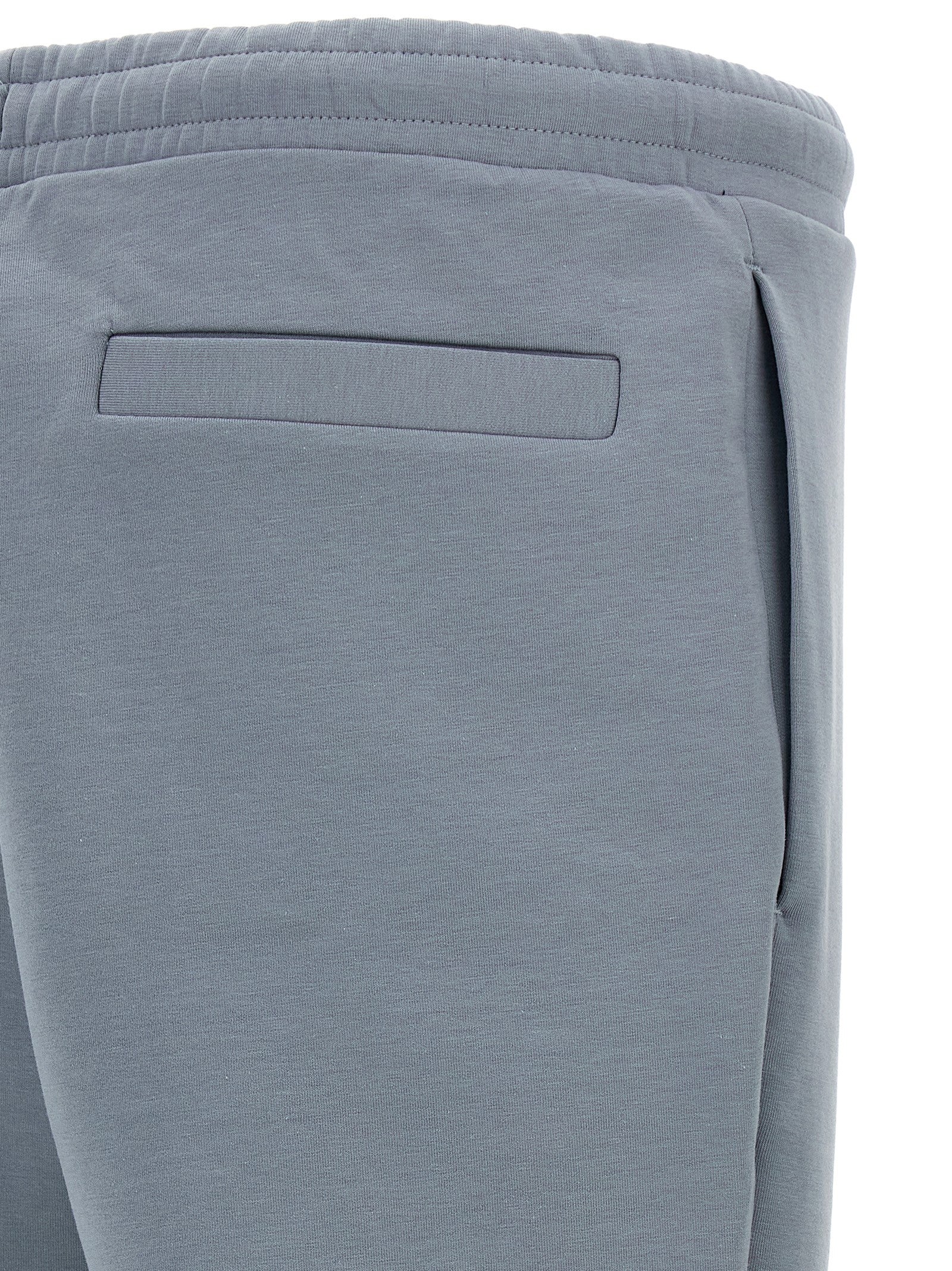 Joggers by Hugo Boss for men in stretch cotton gray presents a tailored silhouette, showcasing a tailored and long cut with a refined for a truly tailored aesthetic.