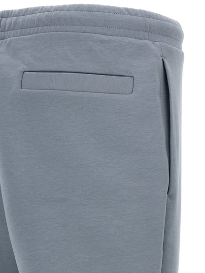 Joggers by Hugo Boss for men in stretch cotton gray presents a tailored silhouette, showcasing a tailored and long cut with a refined for a truly tailored aesthetic.