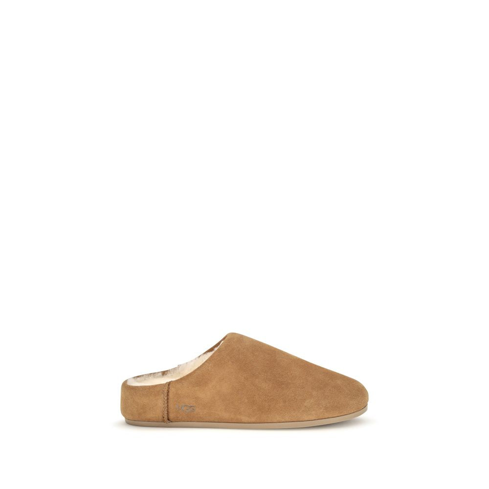 Mules Slippers Flat Shoes by UGG for women in suede leather & rubber beige & signature showcases a resplendent Women's Suede Leather & Rubber Mules Slippers Flat Shoes aesthetic with a and .