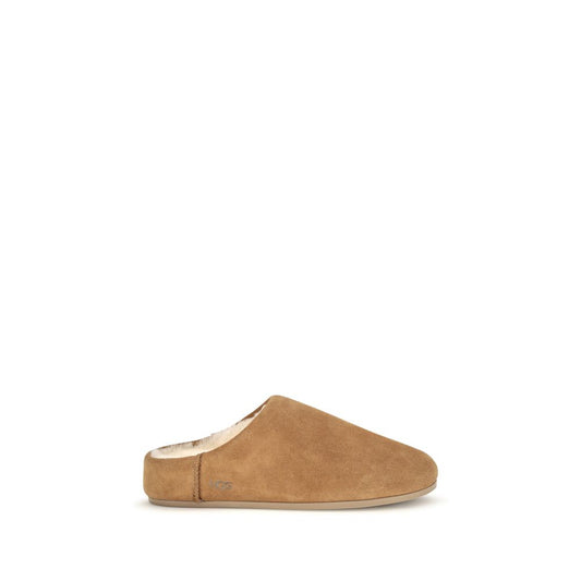 Mules Slippers Flat Shoes by UGG for women in suede leather & rubber beige & signature showcases a resplendent Women's Suede Leather & Rubber Mules Slippers Flat Shoes aesthetic with a and .