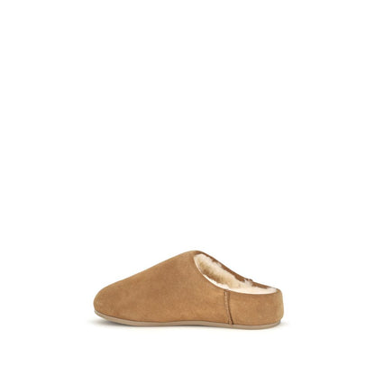 Mules Slippers Flat Shoes by UGG for women in suede leather & rubber beige & signature showcases a resplendent Women's Suede Leather & Rubber Mules Slippers Flat Shoes aesthetic with a and .