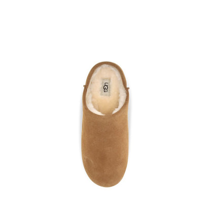 Mules Slippers Flat Shoes by UGG for women in suede leather & rubber beige & signature showcases a enchanting silhouette as part of the Women's Suede Leather & Rubber Mules Slippers Flat Shoes collection, defined by a enchanting and for a enchanting look.