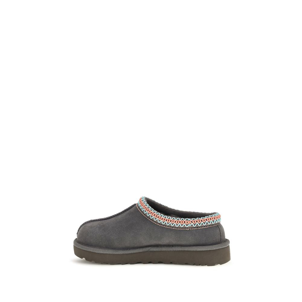 Mules Flat Shoes by UGG for women in eva polyester suede leather gray & signature features an statuesque silhouette from the Women's EVA Polyester Suede Leather Mules Flat Shoes collection, showcasing a and a statuesque for a statuesque look.