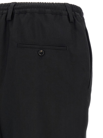 Trousers by Marni for men in virgin wool black, horn & signature presents a smart silhouette, meticulously detailed with a smart tapered-leg, relaxed-fit & cropped, a smart cropped, and a smart .