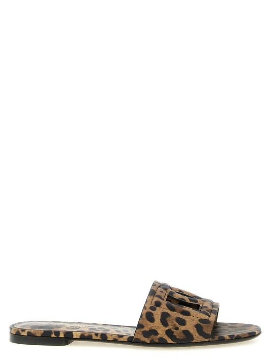 Sliders Sandals Flat Shoes by Dolce & Gabbana for women in calfskin leather brown, leopard-print & print showcases a resplendent Women's Calfskin Leather Sliders Sandals Flat Shoes aesthetic with a and .